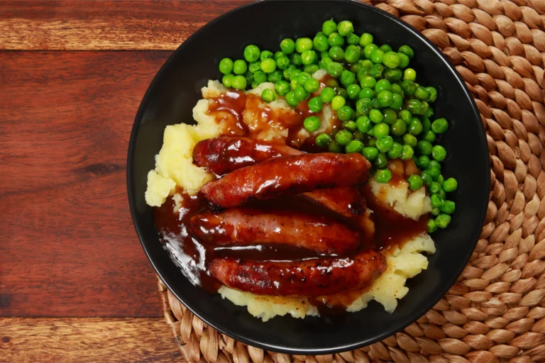 Bangers and mash with rich onion gravy – traditional British comfort food.