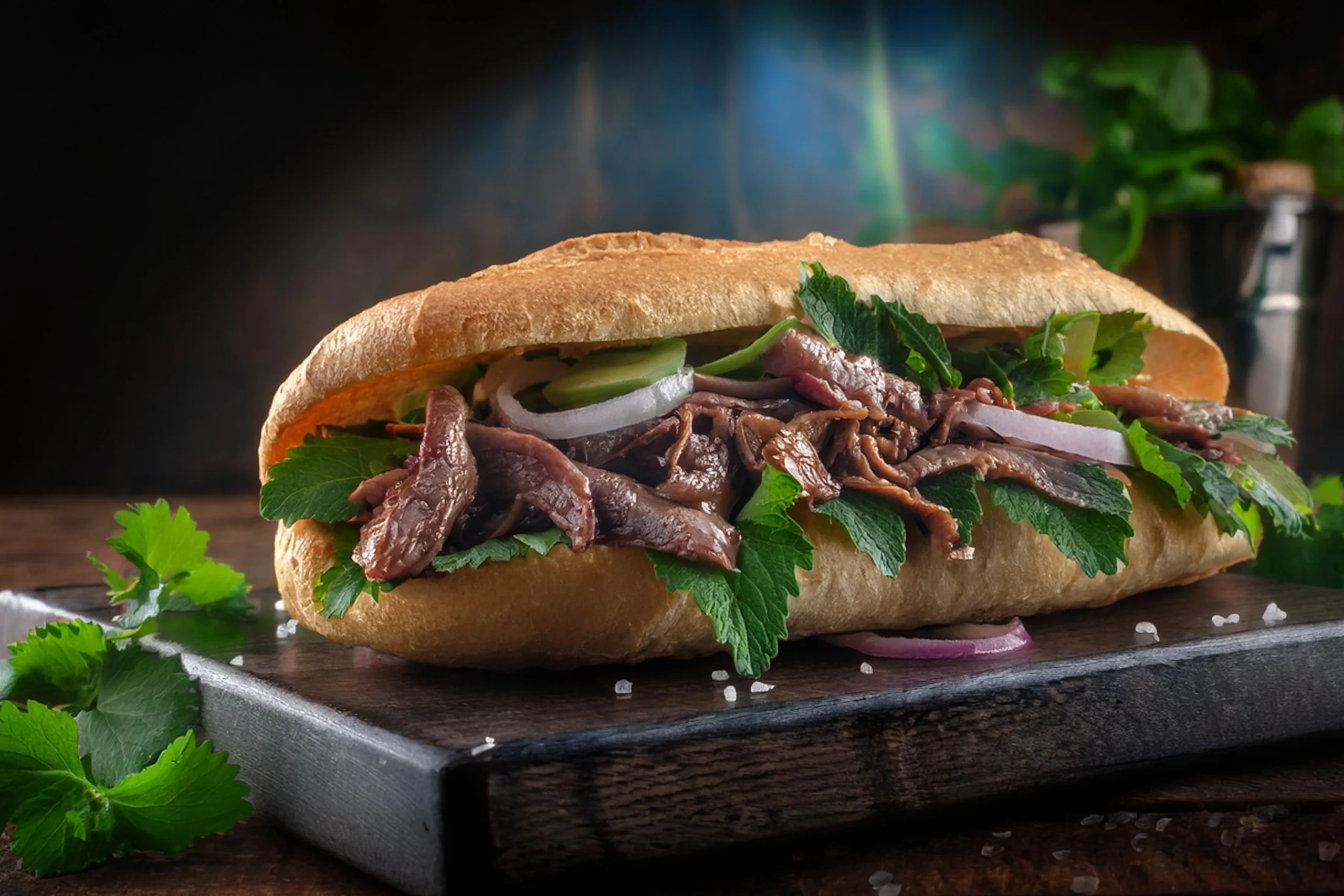 Vietnamese Banh Mi Sandwich with marinated beef and fresh vegetables.