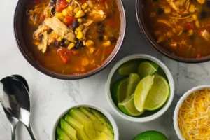 Creamy Chicken Tortilla Soup with black beans, corn, and tortilla chips