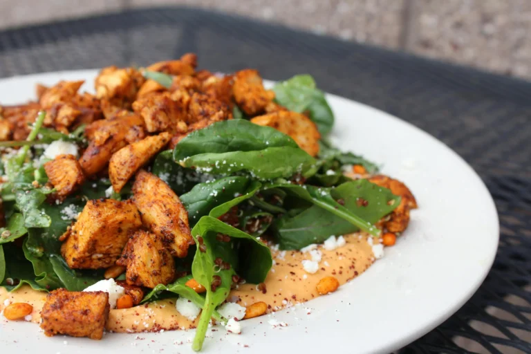 Grilled Chicken Quinoa Salad with fresh vegetables and feta cheese.