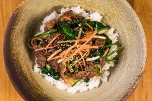 Authentic Korean Beef Bulgogi served with rice and side dishes.