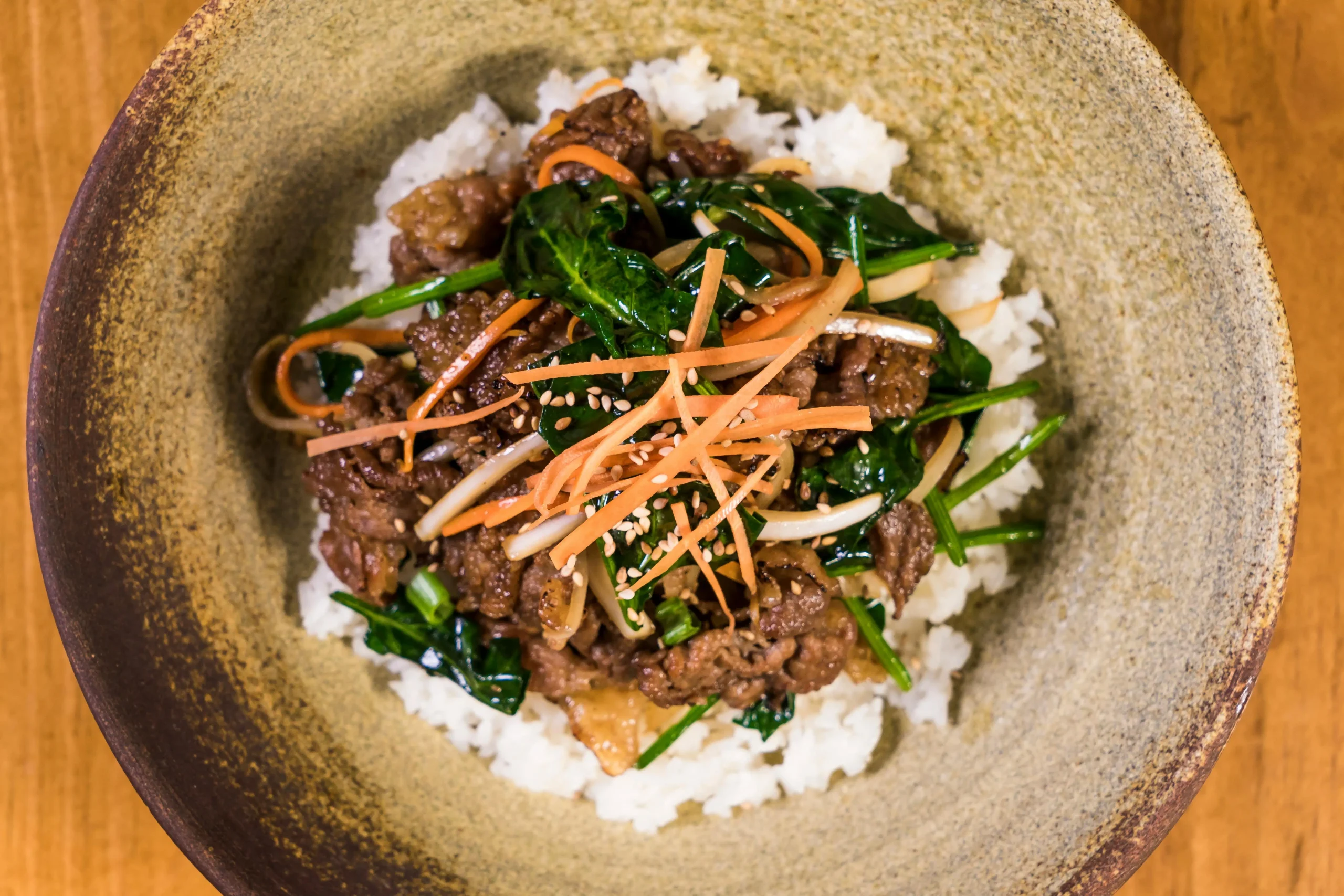 Authentic Korean Beef Bulgogi served with rice and side dishes.